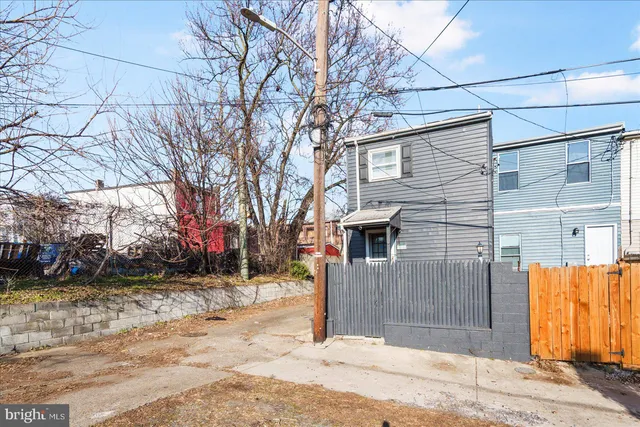 a view of a house with a snow in the yard