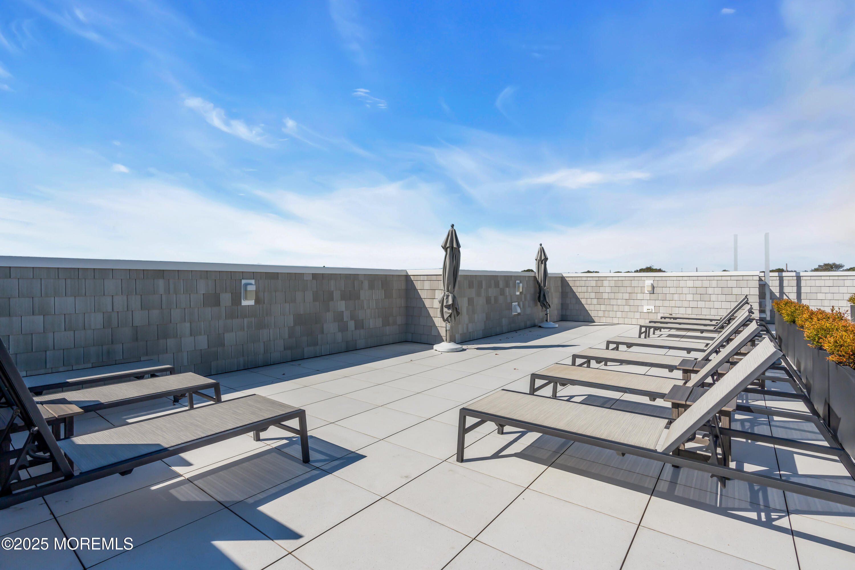 1801 Highway 35, Unit 11 Belmar, NJ 07719 - Photo 11 of 37 a view of a terrace with chairs