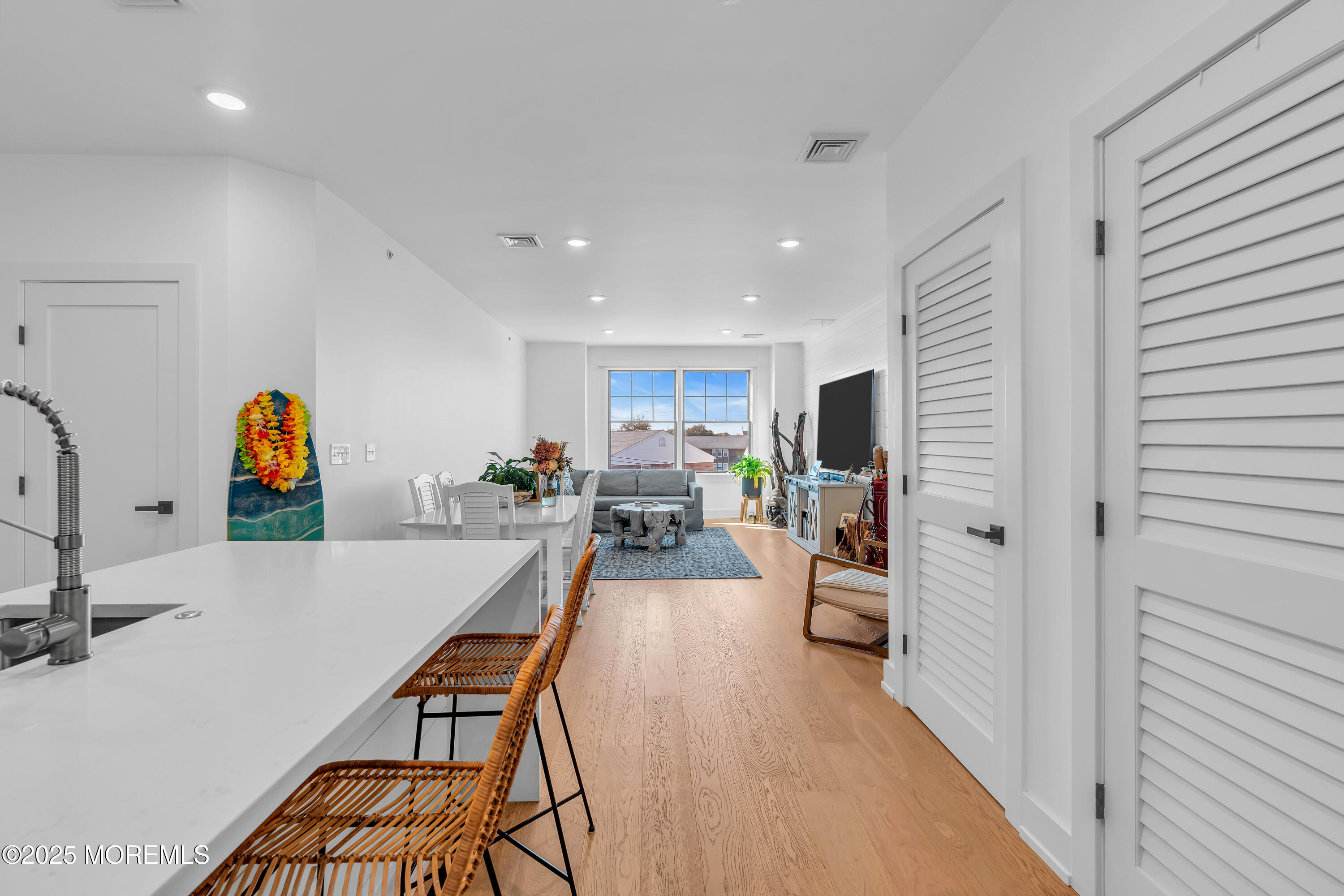 1801 Highway 35, Unit 11 Belmar, NJ 07719 - Photo 12 of 37 a dining room with furniture and a wooden floor