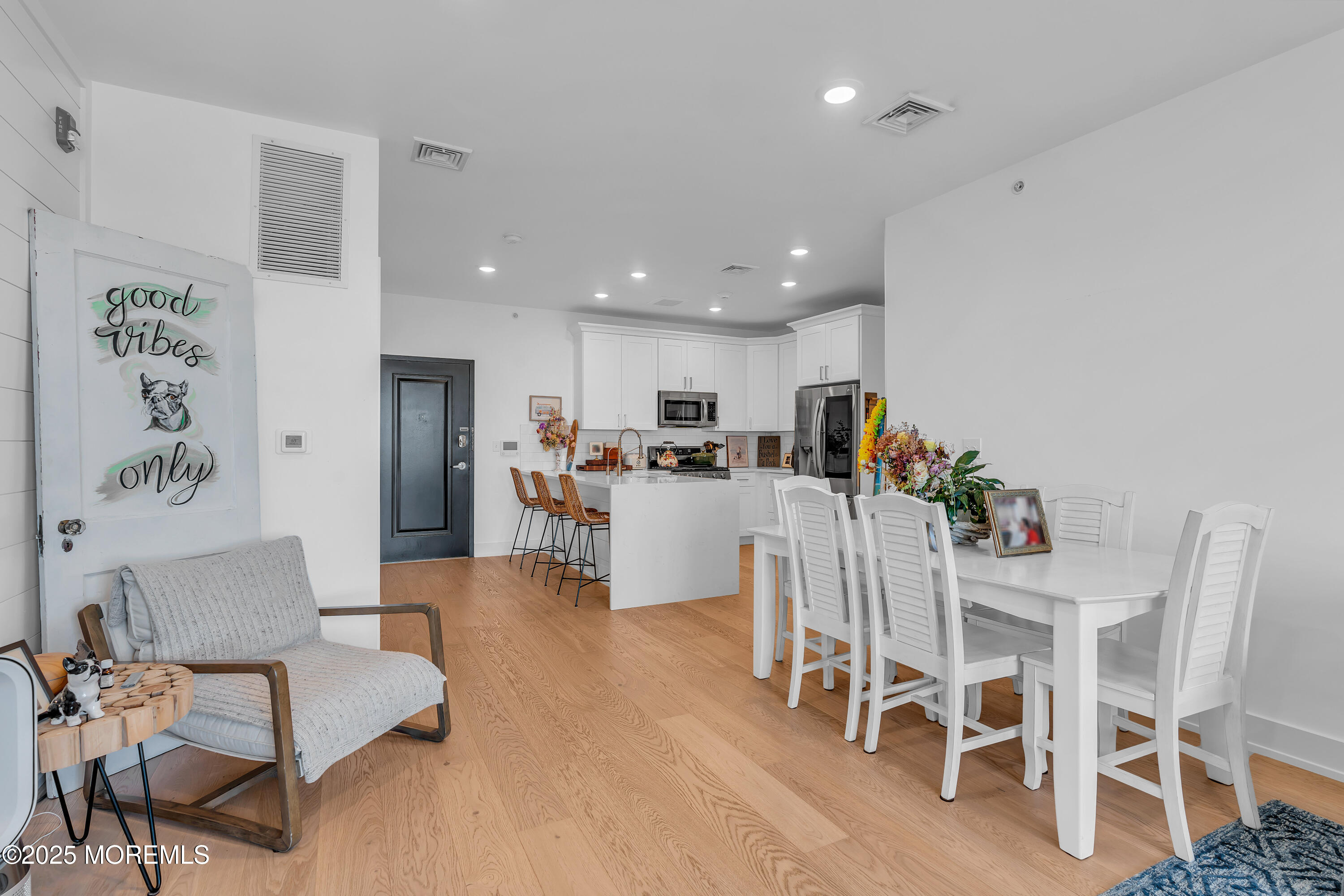 1801 Highway 35, Unit 11 Belmar, NJ 07719 - Photo 22 of 37 a dining room with furniture and kitchen view