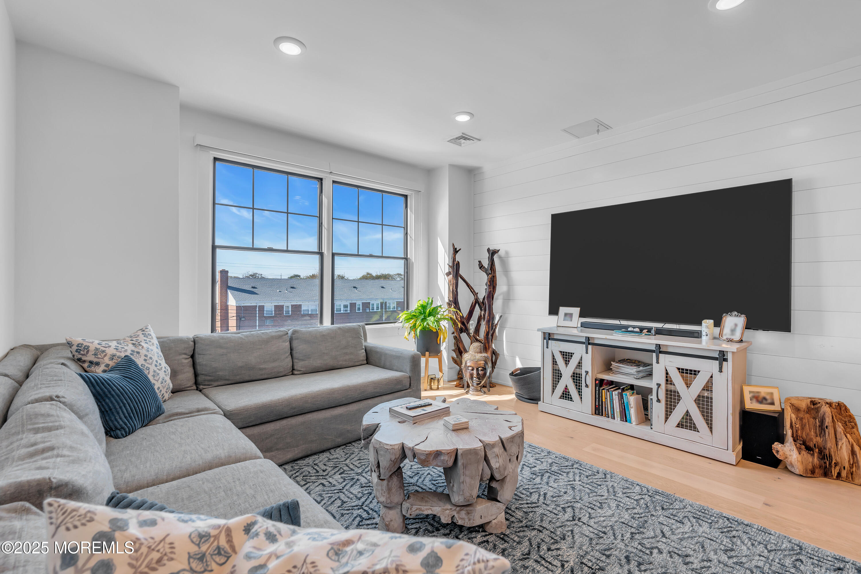 1801 Highway 35, Unit 11 Belmar, NJ 07719 - Photo 28 of 37 a living room with furniture and a flat screen tv