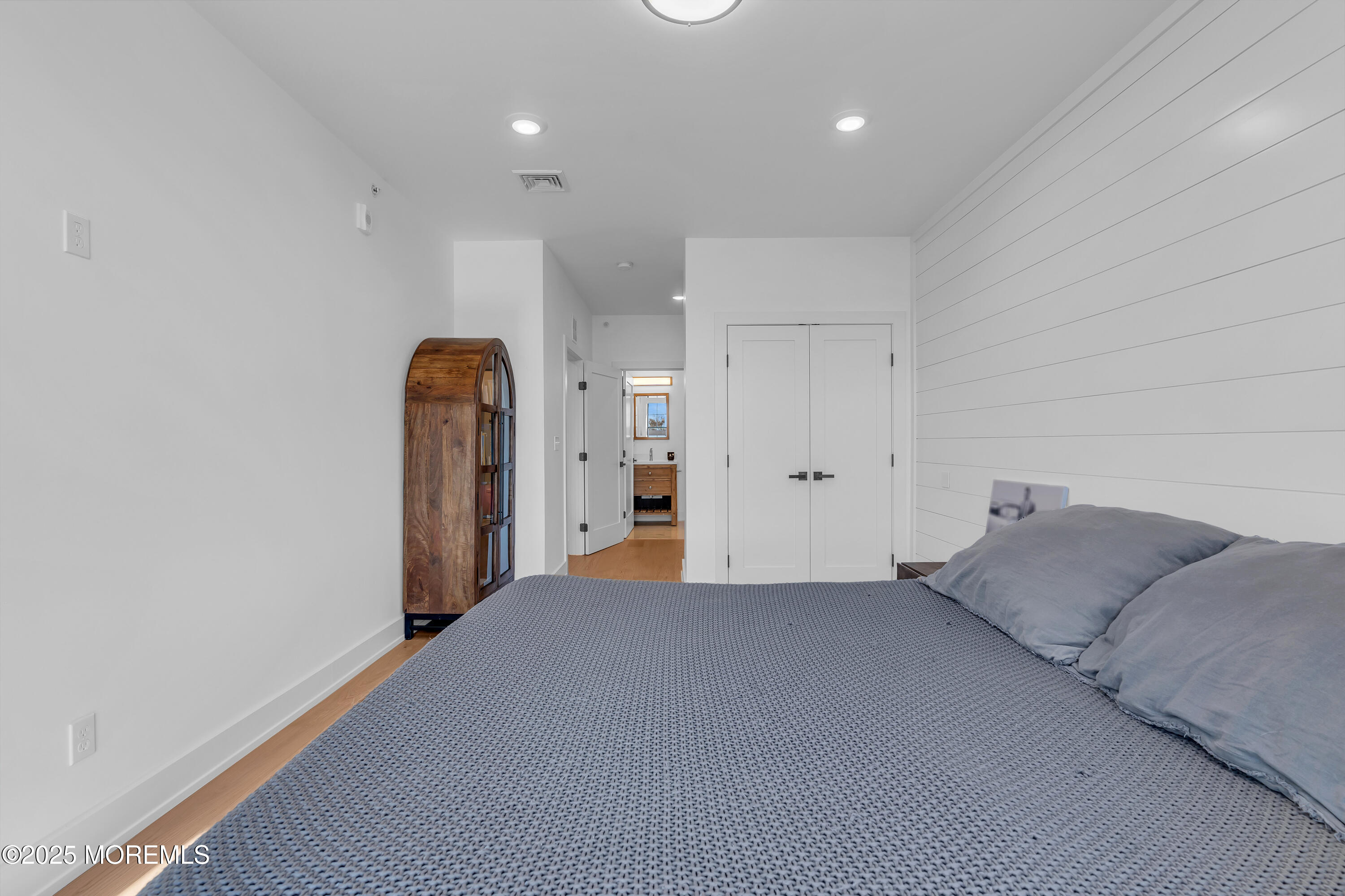 1801 Highway 35, Unit 11 Belmar, NJ 07719 - Photo 33 of 37 a living room with a bed and a refrigerator