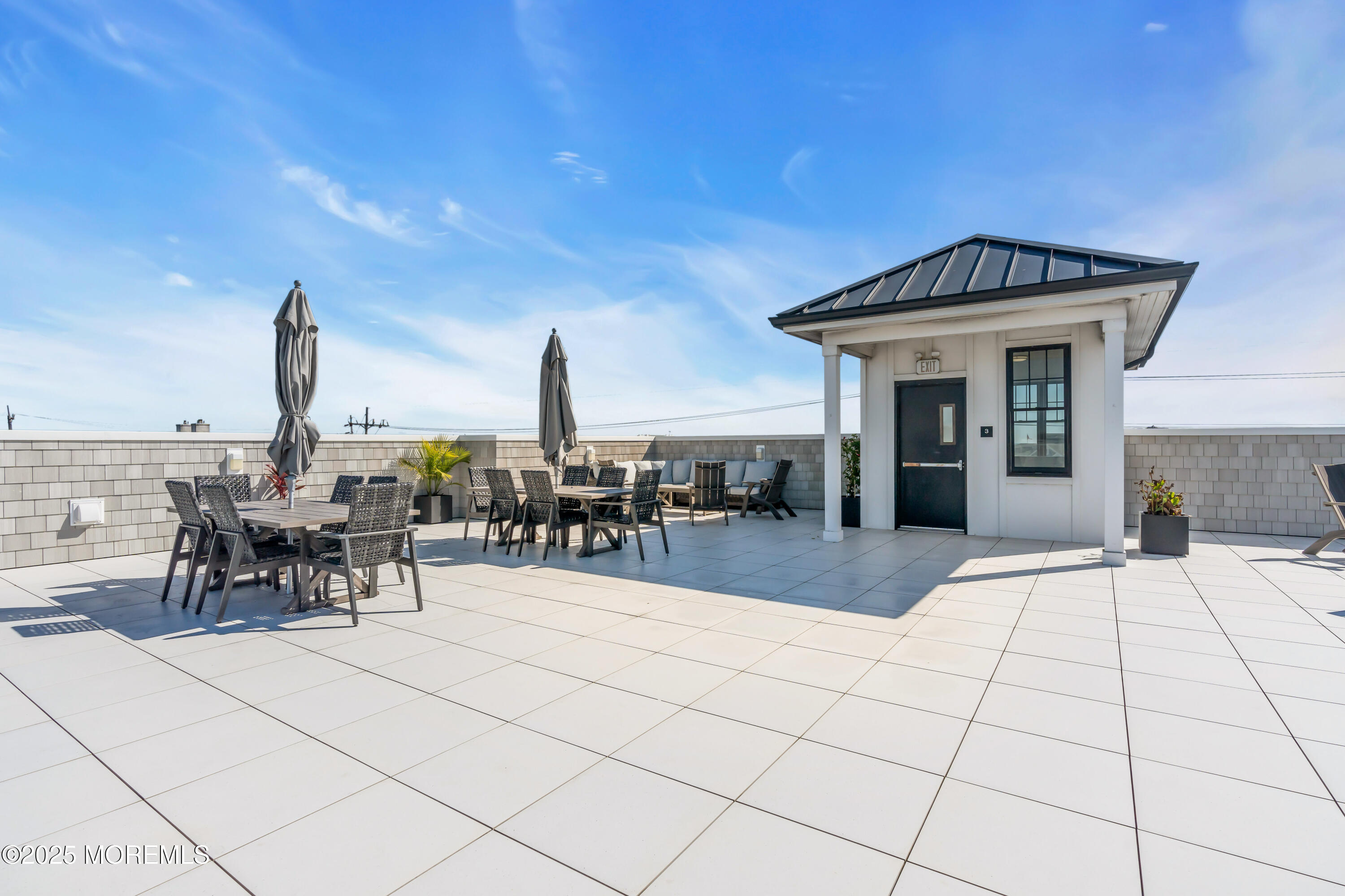 1801 Highway 35, Unit 11 Belmar, NJ 07719 - Photo 10 of 37 a view of a terrace with seating space