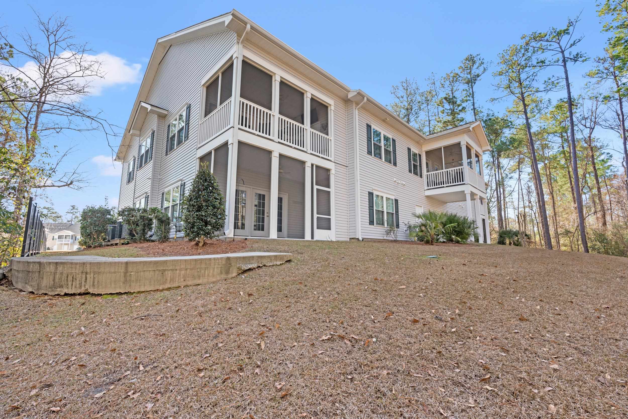 900 Jackline Place, Unit 202 Murrells Inlet, SC 29576 - Photo 36 of 39 Rear view of house featuring a sunroom and french doors