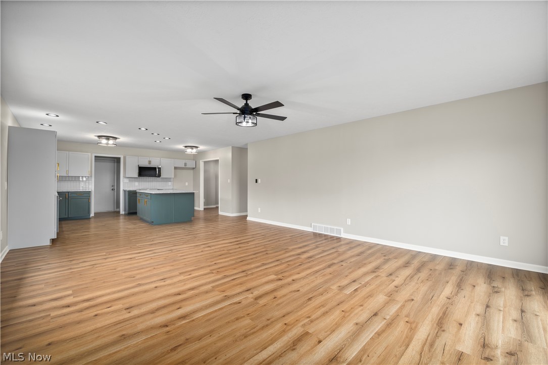 36220 Neff Road Grafton, OH 44044 - Photo 22 of 50 Unfurnished living room featuring a ceiling fan, light wood-style flooring, and recessed lighting