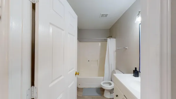 a bathroom with a sink and toilet