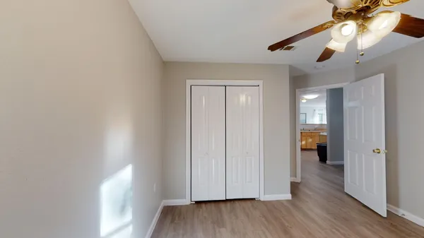 a view of an empty room and wooden floor