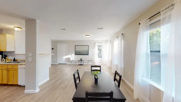 a living room with furniture and a table
