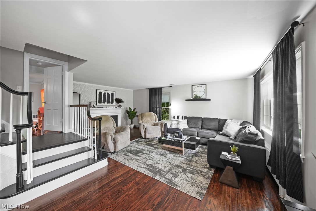 Living room with dark hardwood / wood-style floors