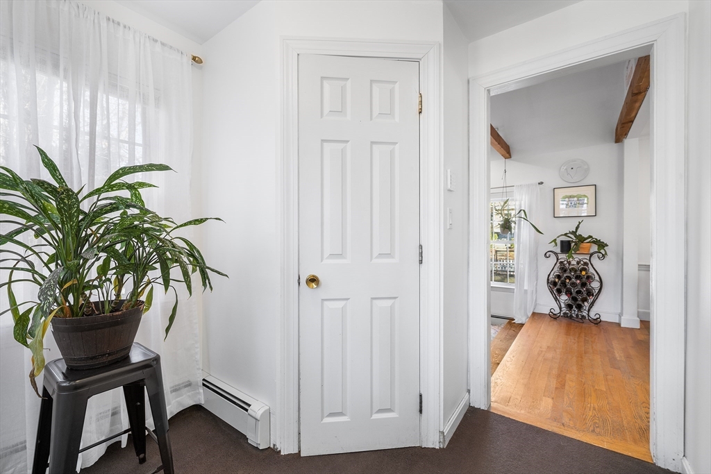 21 Ridge Avenue Newton, MA 02459 - Photo 12 of 27 a view of a hallway with paintings on the wall