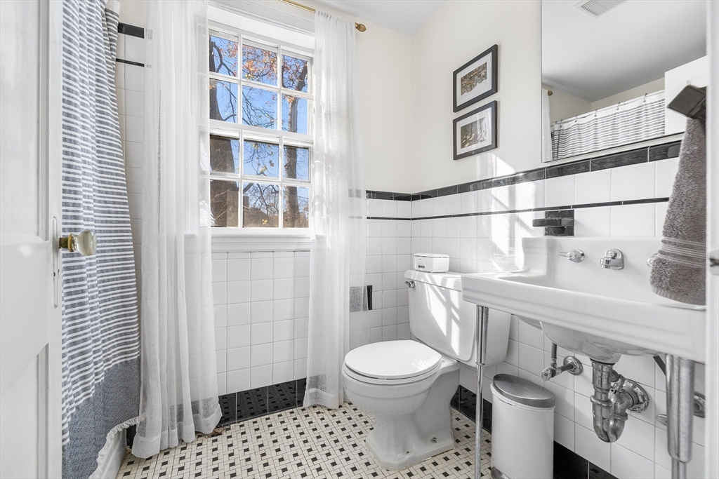 21 Ridge Avenue Newton, MA 02459 - Photo 20 of 27 a white toilet sitting next to a bathroom sink