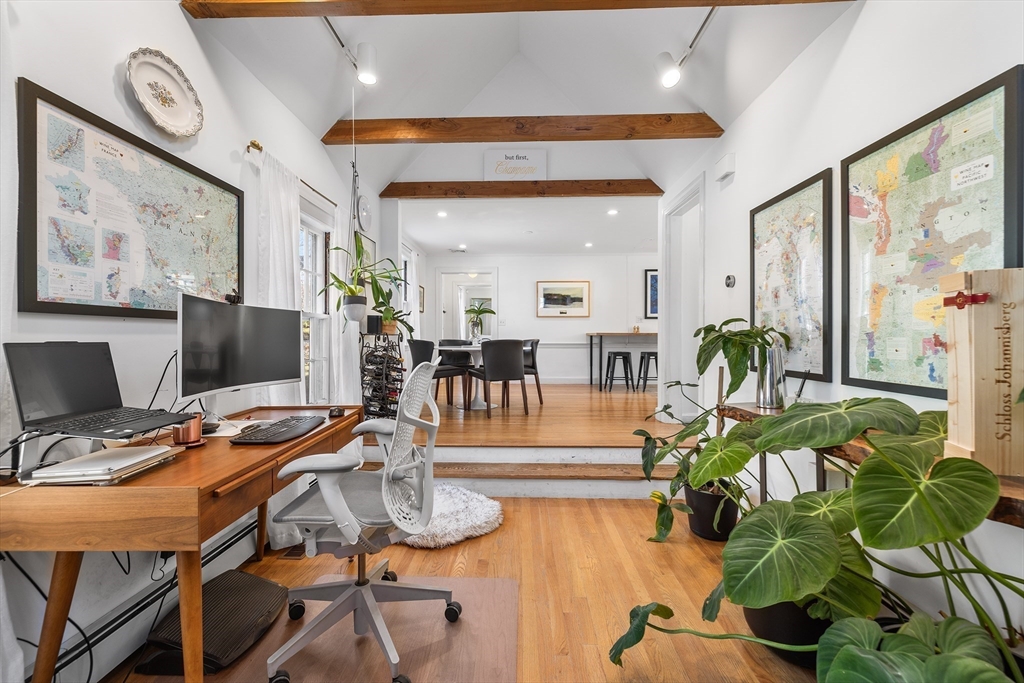 21 Ridge Avenue Newton, MA 02459 - Photo 7 of 27 a view of a dining room with furniture a potted plant and wooden floor