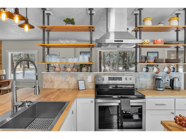 a kitchen with a stove and cabinets