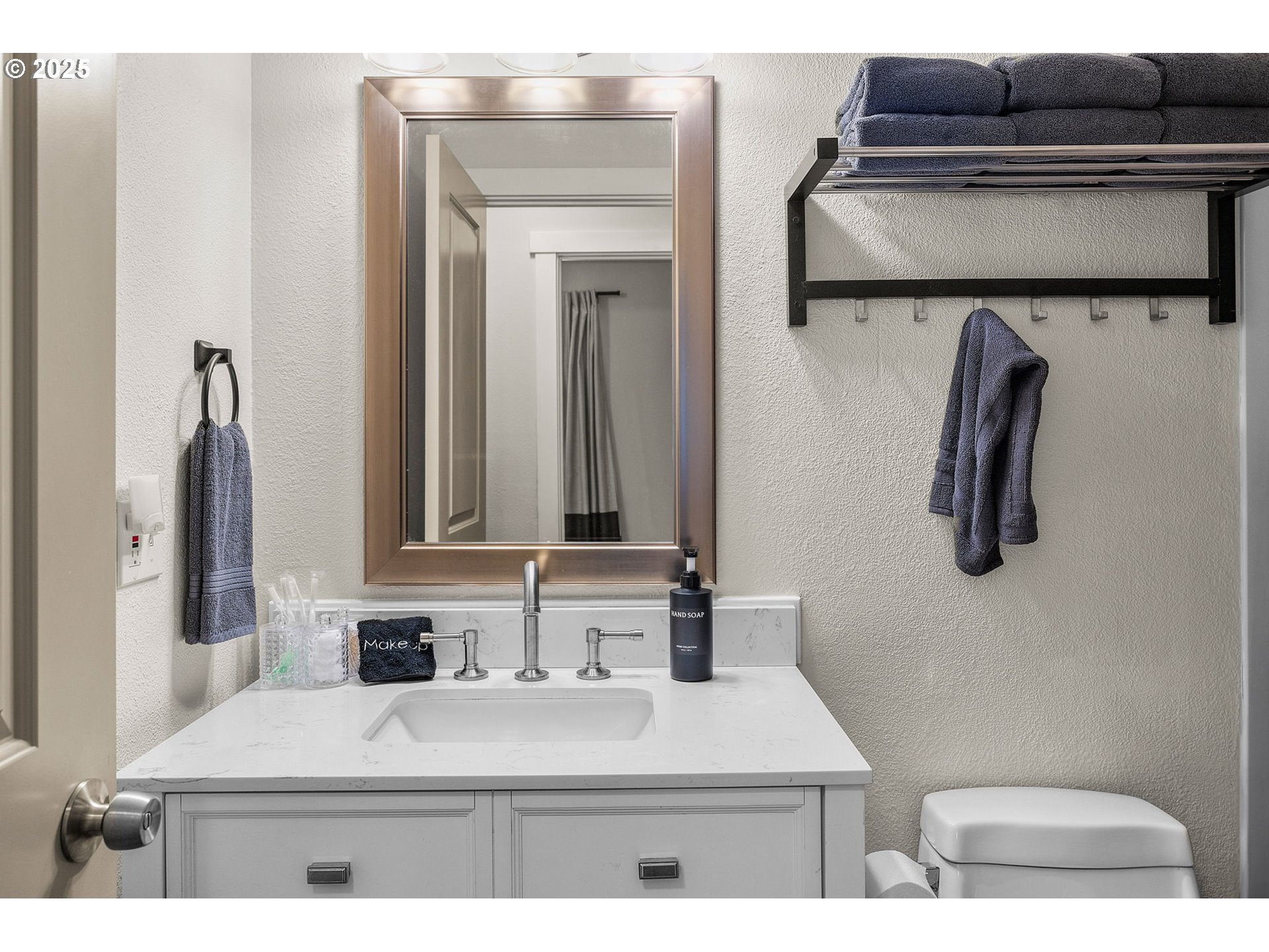 69322 Hackamore Sisters, OR 97759 - Photo 20 of 40 a bathroom with a sink a toilet and mirror