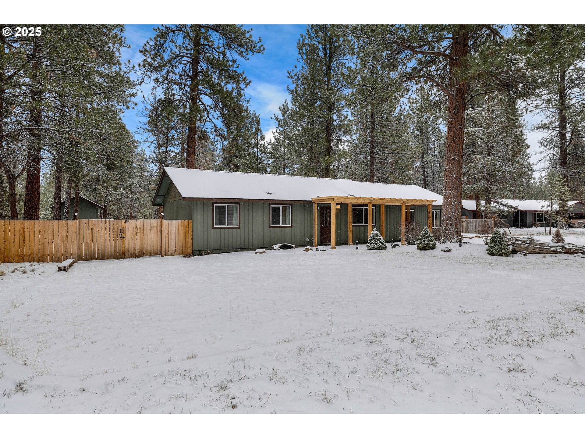 69322 Hackamore Sisters, OR 97759 - Photo 2 of 40 a front view of a house with a yard and garage