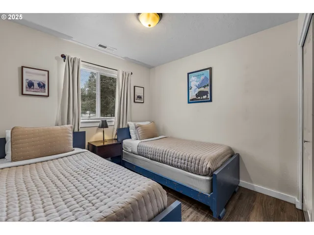 a bedroom with double bed and a window