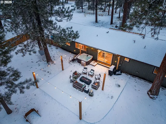 a outdoor space with patio couch and a fire pit