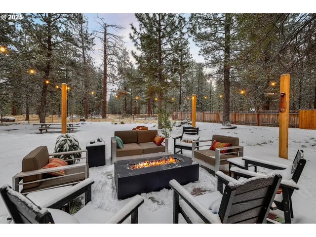 a outdoor living space with furniture potted plant and a large window