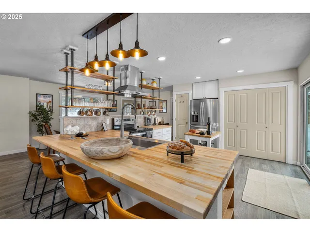 a kitchen with a table and chairs in it