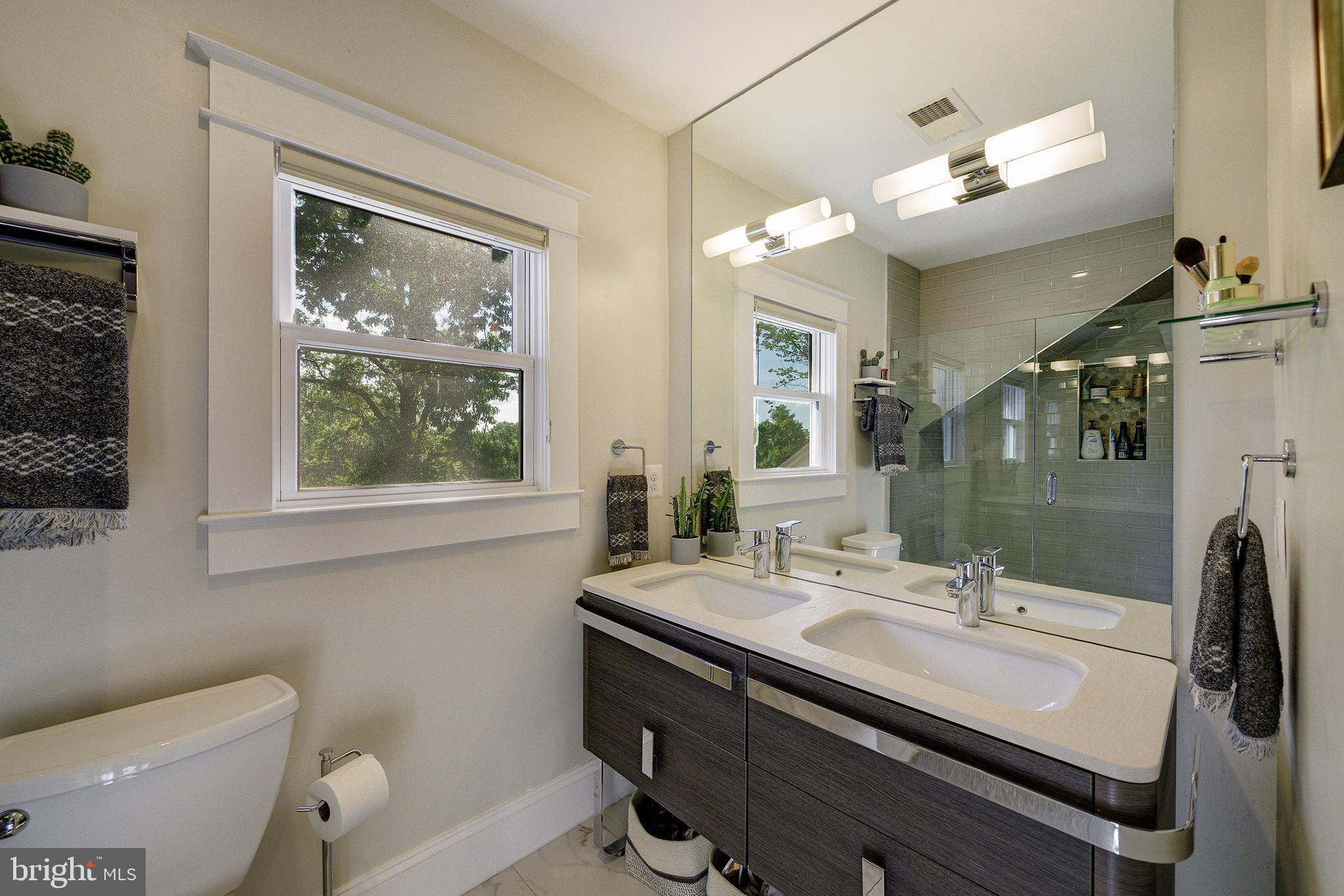 5710 Broad Branch Road Northwest Washington, DC 20015 - Photo 10 of 25 a bathroom with a sink and a mirror