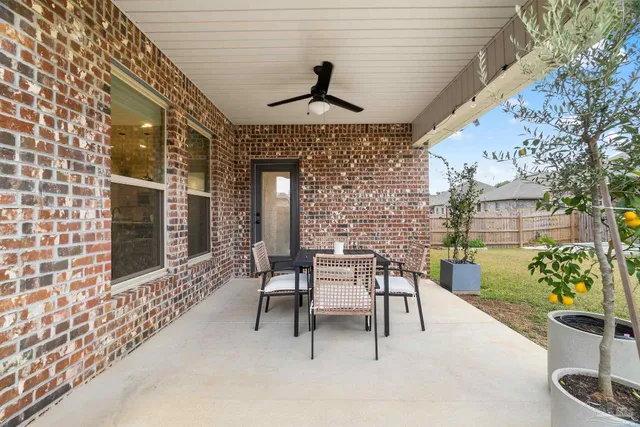 a dining room with furniture and chandelier kitchen view