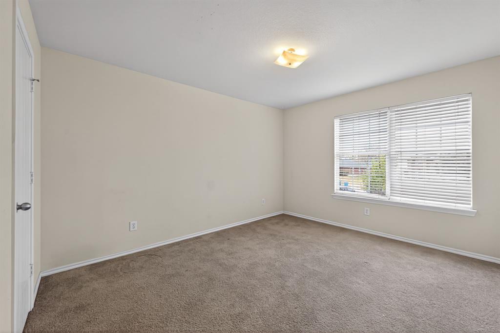 8618 Scooner Street Rowlett, TX 75089 - Photo 12 of 30 an empty room with a empty space and windows