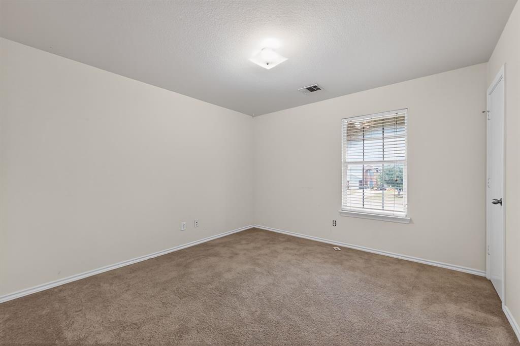 8618 Scooner Street Rowlett, TX 75089 - Photo 14 of 30 an empty room with windows