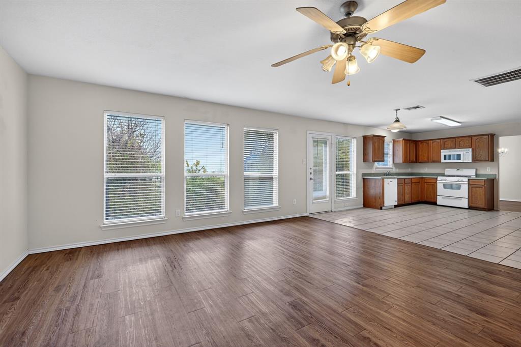 8618 Scooner Street Rowlett, TX 75089 - Photo 18 of 30 a view of an empty room with a window and wooden floor