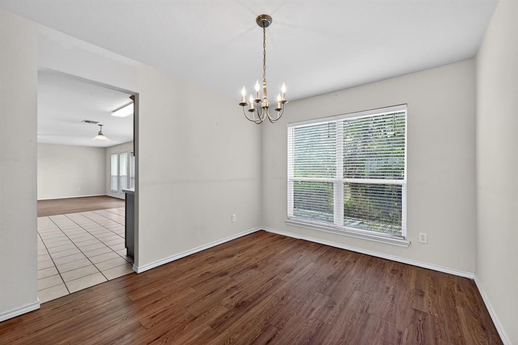 8618 Scooner Street Rowlett, TX 75089 - Photo 24 of 30 wooden floor in an empty room with a window