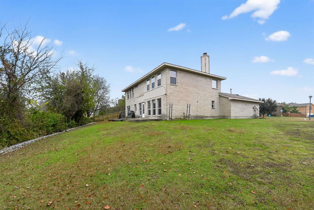 8618 Scooner Street Rowlett, TX 75089 - Photo 5 of 30 a view of a house with a yard