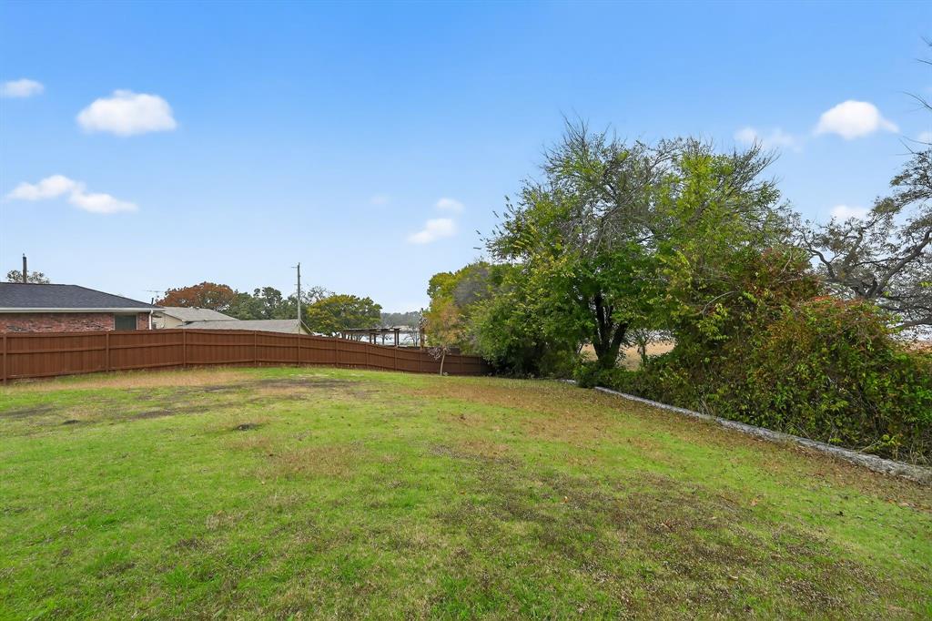8618 Scooner Street Rowlett, TX 75089 - Photo 6 of 30 a view of an ocean and trees