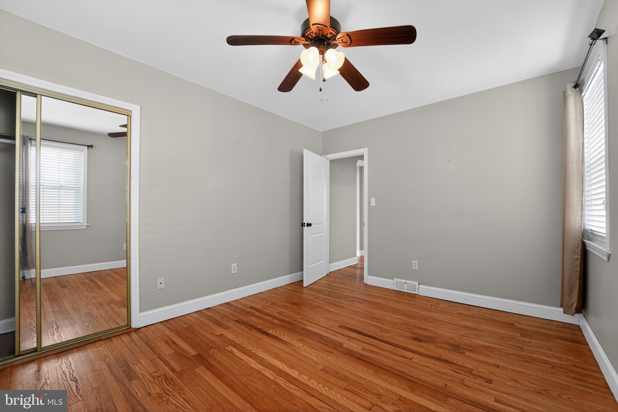 9408 Dana Vista Road Baltimore, MD 21236 - Photo 30 of 38 wooden floor in an empty room with a window
