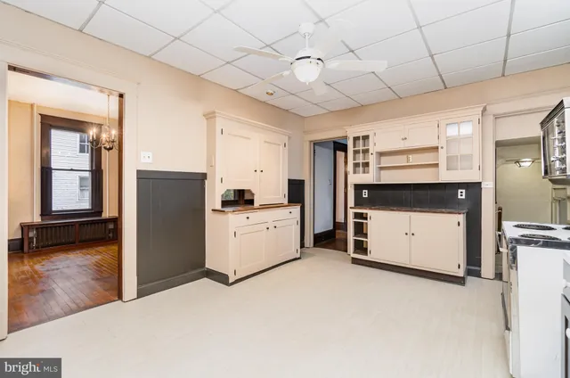 a kitchen with stainless steel appliances a stove sink and cabinets