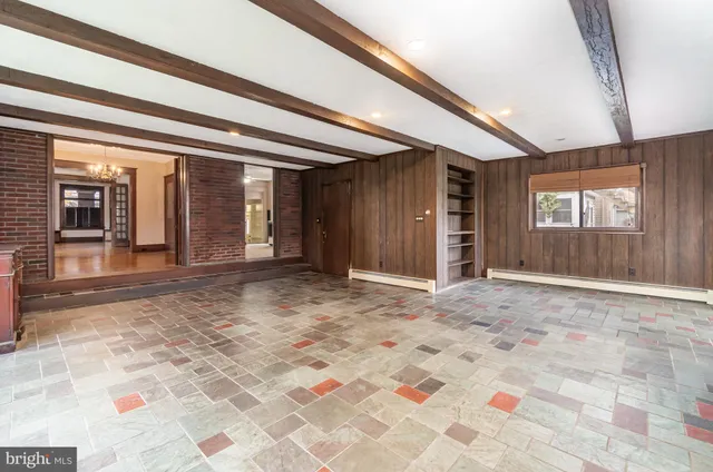 a bathroom with a sink a toilet a mirror and shower