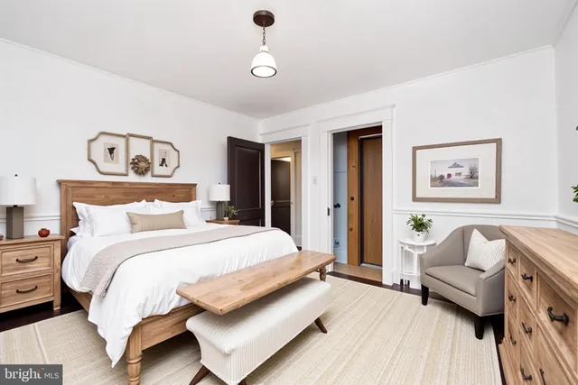 a view of a big room with windows and furniture