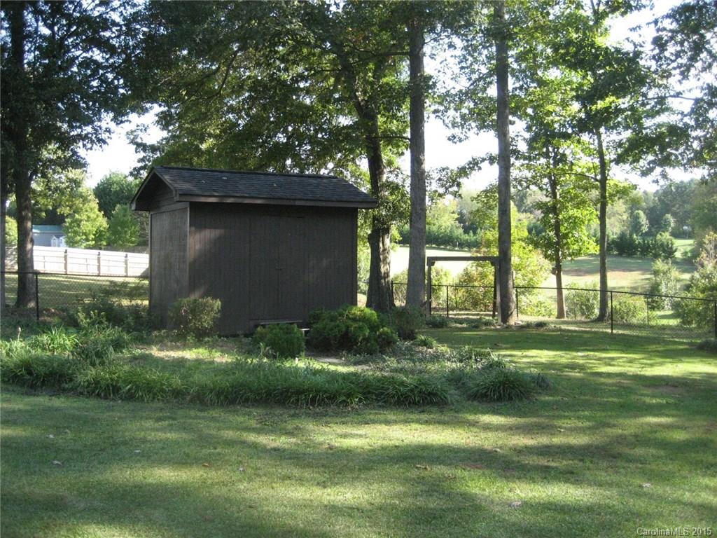 755 Shady Forest Road, Unit 2 Clover, SC 29710 - Photo 15 of 24 a backyard of a house with lots of green space and fountain in the back