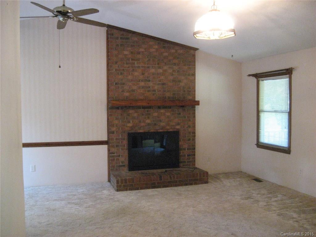 755 Shady Forest Road, Unit 2 Clover, SC 29710 - Photo 3 of 24 a living room with furniture and a fireplace