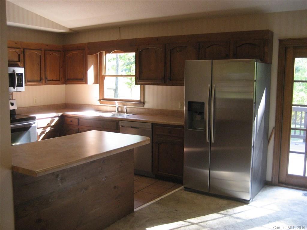 755 Shady Forest Road, Unit 2 Clover, SC 29710 - Photo 4 of 24 a kitchen with stainless steel appliances granite countertop a refrigerator a sink and a stove