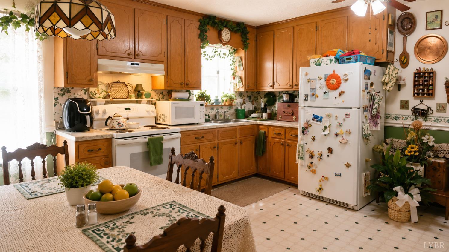 2346 Mitchell Mill Road Gladys, VA 24554 - Photo 6 of 38 a kitchen with stainless steel appliances a sink a stove a chimney a refrigerator and dining table