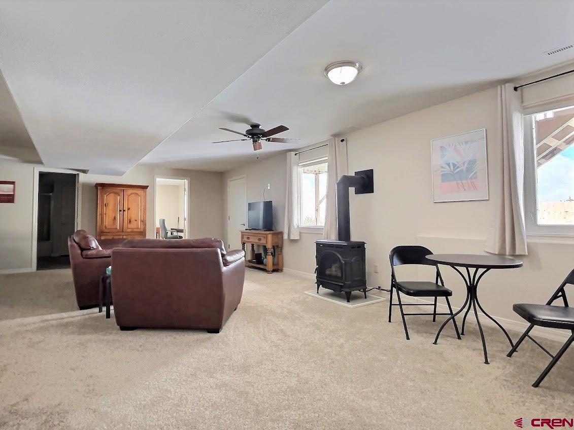 24835 Cactus Park Road Cedaredge, CO 81413 - Photo 17 of 35 a living room with furniture and a window