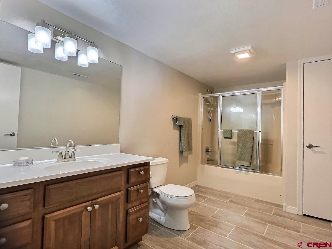 24835 Cactus Park Road Cedaredge, CO 81413 - Photo 20 of 35 a bathroom with a sink a toilet and shower