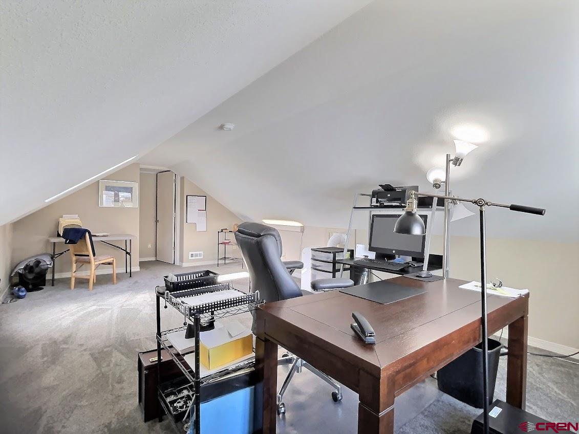 24835 Cactus Park Road Cedaredge, CO 81413 - Photo 24 of 35 a view of a workspace with furniture