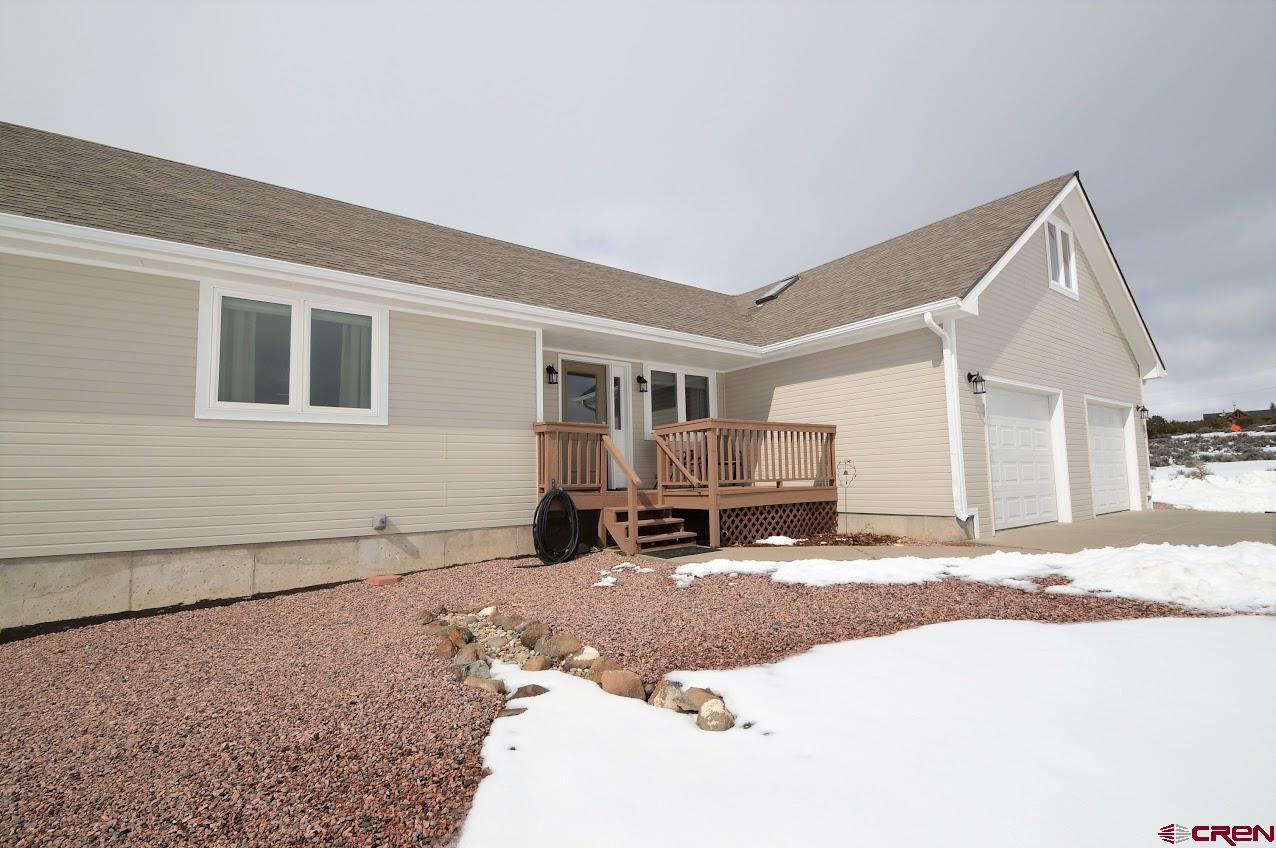 24835 Cactus Park Road Cedaredge, CO 81413 - Photo 26 of 35 a view of living room and a couch