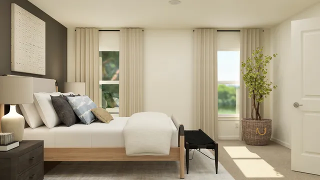 a bedroom with a bed lamp and a window