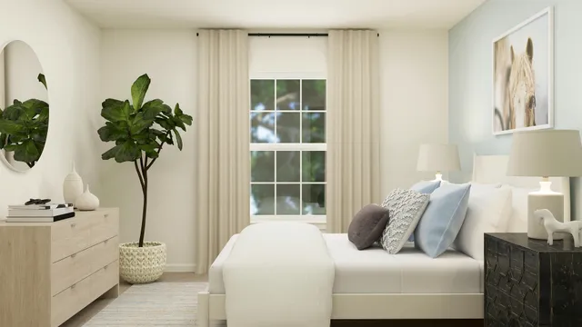 a bedroom with a bed and a potted plant