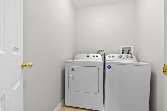 an empty room with a empty space and windows