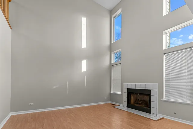 a view of empty room with fireplace