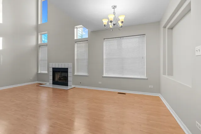 a view of empty room with fireplace