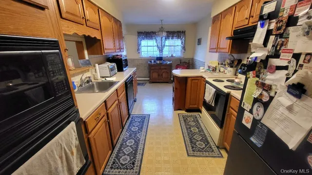 a view of a kitchen with seating area