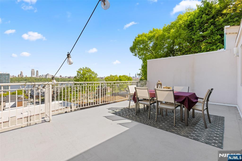7 Oakdene Terrace, Unit 7 Edgewater, NJ 07020 - Photo 24 of 30 a view of a chairs and table in the terrace
